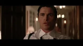 Man in suit and tie looking seriously — Batman