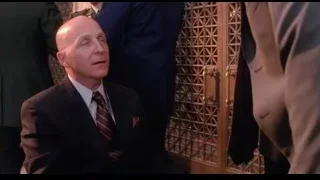 Bald man in suit deep in thought — Spider Man