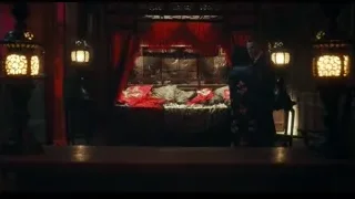 man and woman in dimly lit room with red curtains — Peaky Blinders