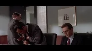 Three men in office one lying on desk — American Psycho