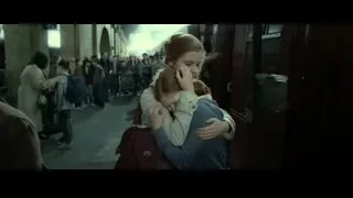 woman hugging girl in train station — Harry Potter and the Deathly Hallows 2