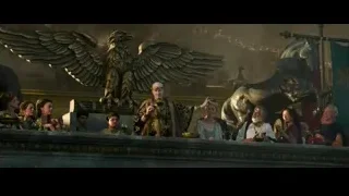People gathered around eagle statue in temple — Gladiator 2