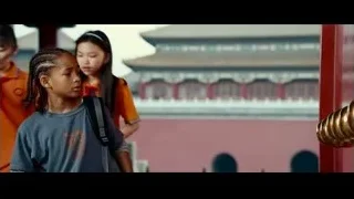 Young girl at red gate with golden handle — The Karate Kid