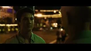 Young man standing on busy street at night — Whiplash