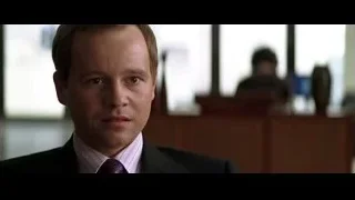 man in suit looking at camera — Batman: The Dark Knight
