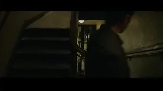 two people on old dimly lit staircase — The Social Network
