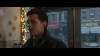 man looking out window at city street — Spiderman: No Way Home