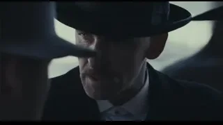 Man in suit and top hat looking serious — Peaky Blinders