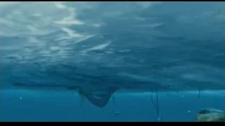 Person on red raft picking from ocean — Life of Pi