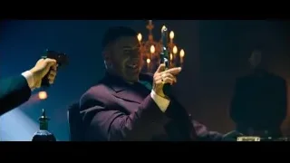 Man in purple suit holding guns — John Wick: Chapter 4
