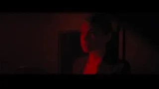 person deep in thought in dimly lit room — La La Land