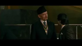 two men talking in room with marble wall — The Dictator
