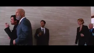 group of people in formal attire in lobby — Iron Man