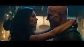 Bald man and woman in tense embrace — Deadpool 2