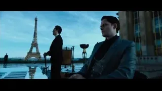 Man sitting in front of Eiffel Tower — John Wick: Chapter 4