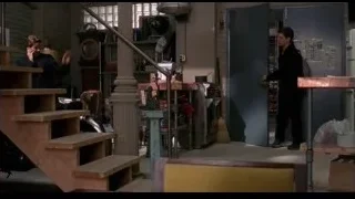 two men in room with staircase and blue door — Spider Man