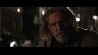man with beard in dimly lit room — Batman