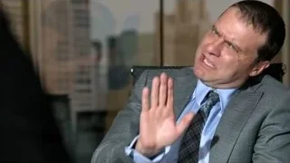 man in suit shouting in office chair — Suits