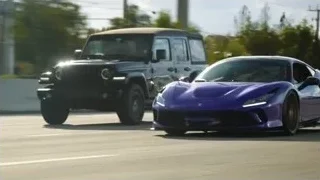 blue sports car driving on city street — Sports Cars