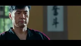 man's face in karate uniform serious — The Karate Kid
