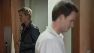 Two men conversing in hallway — Suits