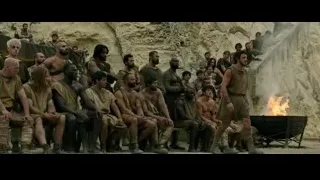 men in ancient clothes by fire — Gladiator 2