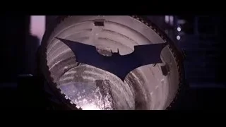 close-up of circular Batman logo object — Batman: The Dark Knight