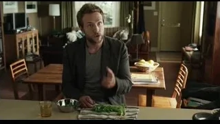 Man at kitchen table with greens and whiskey — Life of Pi