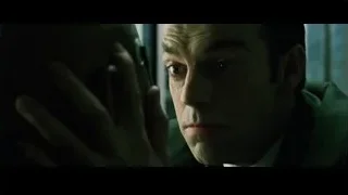 Man in suit deep in thought — The Matrix