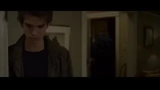 Young man standing in dimly lit hallway — The Amazing Spider Man