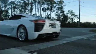 white sports car driving on road — Sports Cars