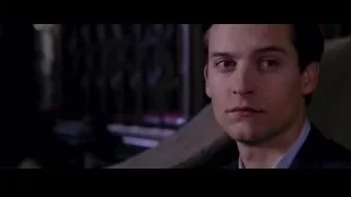 man in suit in dimly lit room — Spider Man 2