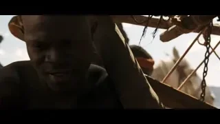 shirtless African man holding wooden stick outdoors — Gladiator