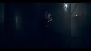 man holding gun in dark room — Peaky Blinders