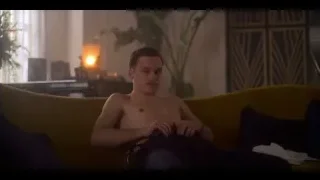 Shirtless man on yellow couch in thought — Peaky Blinders