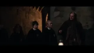 Ron and Hermione in dimly lit stone room — Harry Potter and the Philosophers Stone