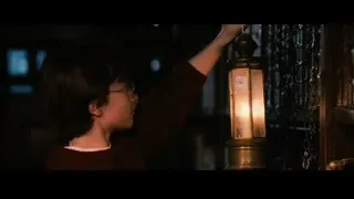 boy reaching for lamp post chain — Harry Potter and the Philosophers Stone