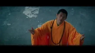man in orange robe meditative pose — Bruce Lee: Birth of The Dragon
