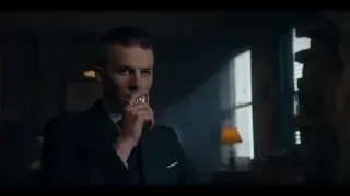 young man in dark room holding cigarette — Peaky Blinders