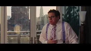 man looking at city skyline from balcony — The Wolf Of Wall Street