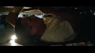 man resting in dimly lit room — Ford v Ferrari