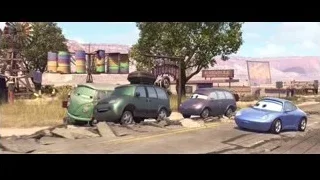 three Cars characters on dirt road — Cars