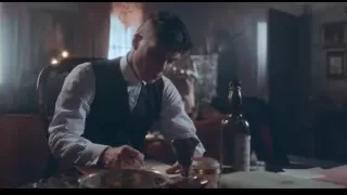 Man writing at table in dim light — Peaky Blinders