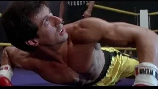 Man lying on mat in boxing ring — Rocky III