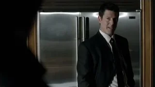 Man in suit by dark refrigerator — Suits