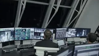 people in control room with multiple monitors — Elon Musk: Return to Space