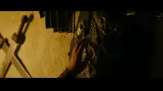 Hand on metal object in dark — Gladiator 2