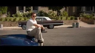Man sitting on vintage car hood — Ford v Ferrari