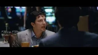 Two men talking at restaurant table — The Big Short
