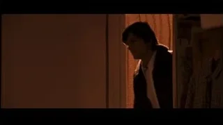 young man in dimly lit room deep in thought — Jobs